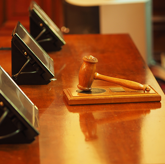 Image showing court desk with computer screens and gavel